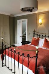 Bedroom with red accent decor at 59 William Street
