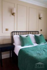 Bedroom with green accent decor at 59 William Street