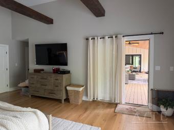Primary bed room with entrance to outdoor living space